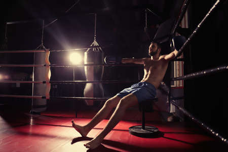 Professional boxer having break during training - Stock Image - Everypixel