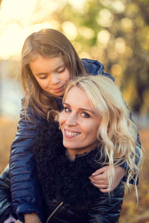 Mom daughter autumn walk family - Stock Image - Everypixel