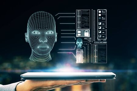 Close up of hands using tablet with abstract glowing head outline ...
