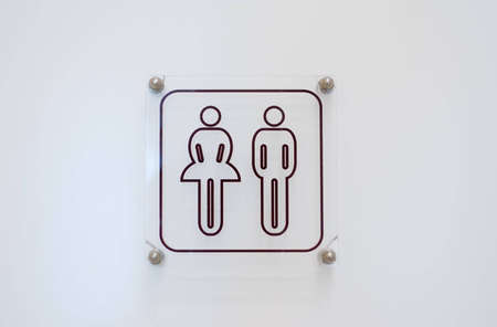 Toilet sing on white doorの写真素材