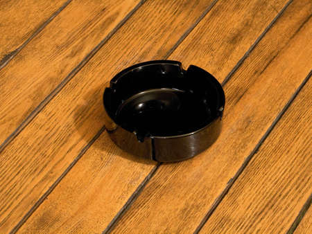 Ashtray on wooden tableの写真素材