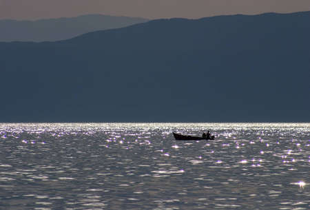Boat floating in dusk