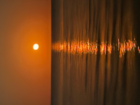 Moon Reflection Over Calm Ocean at Night.の写真素材