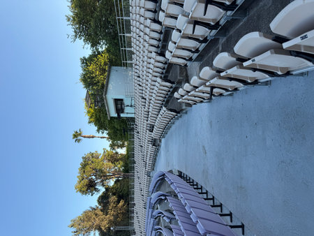 An open-air theater with seats for spectators. An empty theater without spectators.