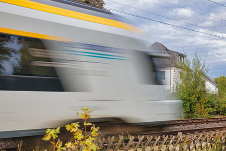Train moving on railroad tracks. Blurred motion of high speed train.