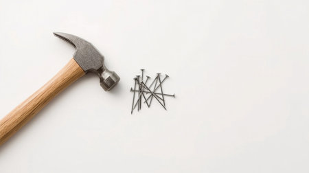 Hammer and nails on a white background with space for text.の素材