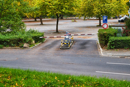 Road curbs and signs in the city park. Autumn season.