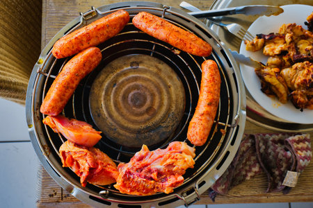 Barbecue with sausages and sausages on the grill
