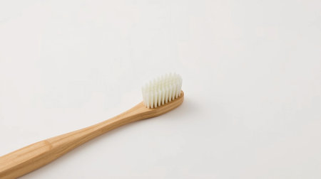 Wooden toothbrush on white background with copy space for your textの素材