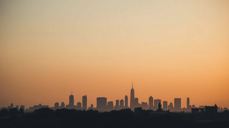 New York City skyline at sunset with urban skyscrapers and buildingsの素材