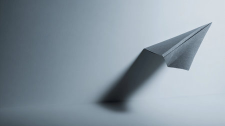 A paper airplane flies in the corner of a startup message screen in a simple design.の素材