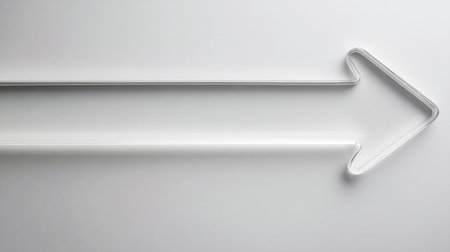 A glass arrow points upward against a simple background, symbolizing growth and progress in a bold way.の素材