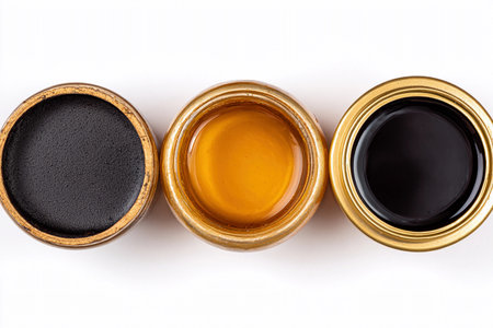 Three types of honey packaging are arranged together in a simple and neat way for viewing.の素材