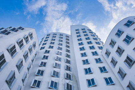 Modern apartment buildings on a sunny day with blue sky. Facade of a modern apartment building