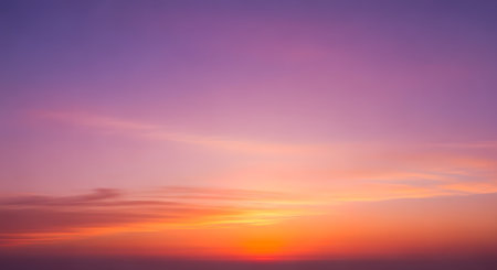 Colorful sunset sky background. Colorful sky with clouds at sunsetの素材