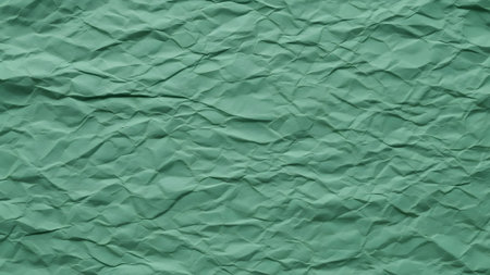 Green crumpled paper background. Crumpled paper texture.の素材