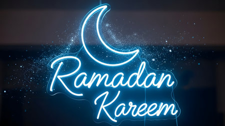 Ramadan Kareem neon lettering with crescent moon and starsの素材