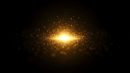 Abstract gold light effect on black background. Glowing glitter particles.の素材