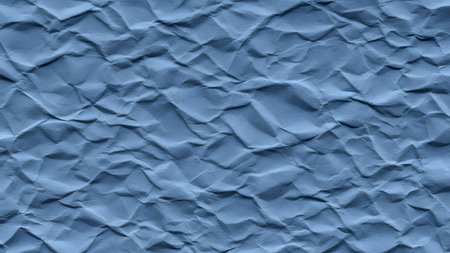 Blue wrinkled paper background. Texture of crumpled paper.の素材