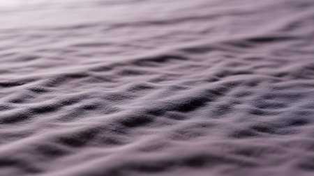 Close-up of the surface of a bed with a blanket.の素材