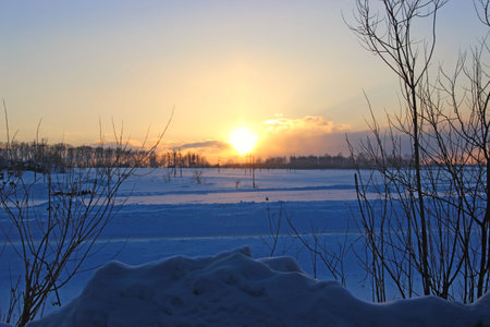 Winter landscape of the countryside at sunset.の写真素材