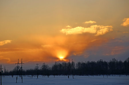 Winter landscape of the countryside at sunset.の写真素材
