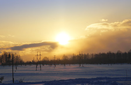 Winter landscape of the countryside at sunset.の写真素材