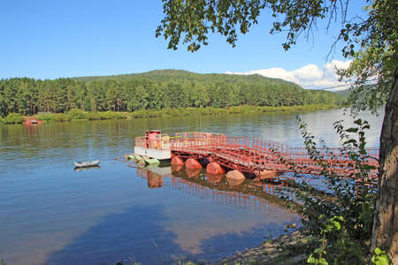 The ferry for transporting people across the river came from the last century.の写真素材