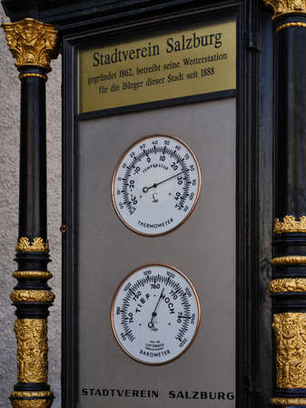 Street thermometer and barometer in Salzburg, Austriaの写真素材