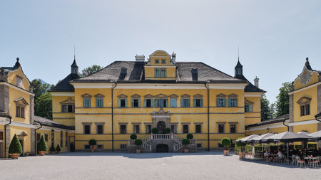 Front outer wall facade of Hellbrunn Palace with windows, staircase and entrance, Salzburg, Austria