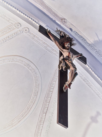 Jesus on the cross in the chapel of the medieval castle Hohenwerfen in Austriaのeditorial素材