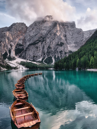 Lago di Braies and wooden boats, Dolomites, Italyの写真素材