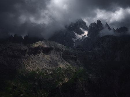 Cadini di Misurina in darkness illuminated by sunlight, Dolomites, Italyの写真素材