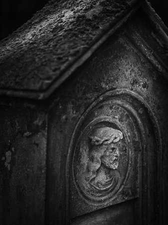 Weathered stone relief on an old monument at Goat's Gate Cemetery, Bratislava â atmospheric black and white.の写真素材