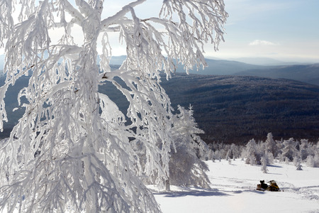Snowmobile stands in deep snowdrifts of the mountains of the Southern Urals.の写真素材