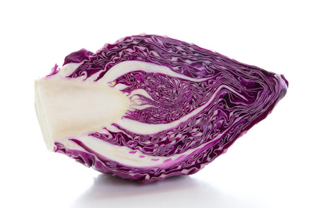 Half of red cabbage on a white background. Diet food.の写真素材