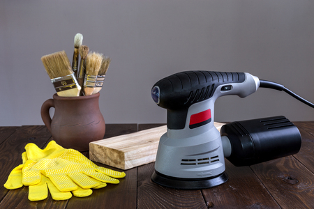 Hand grinder on a wooden surface.の写真素材