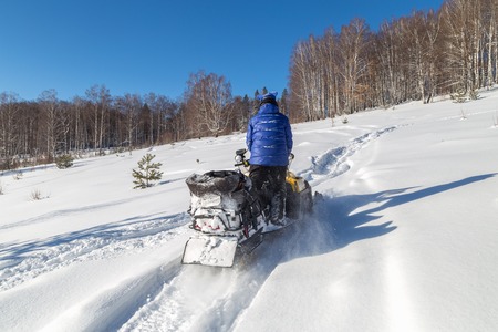 Walk on snowmobiles in the mountains of the Urals.の写真素材