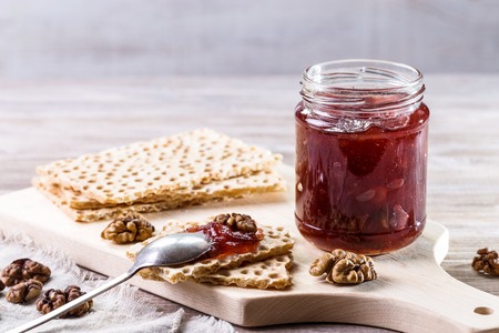 Crispy toast with jam on a light background.の写真素材