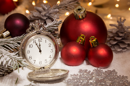 Vintage clock with christmas decorations and lightsの写真素材
