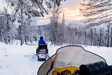 Walk on snowmobiles in the mountains of the Urals.の写真素材