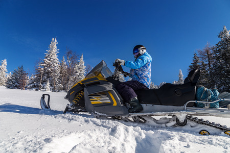 Athlete on a snowmobile.の写真素材