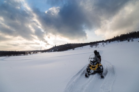 Athlete on a snowmobile.の写真素材