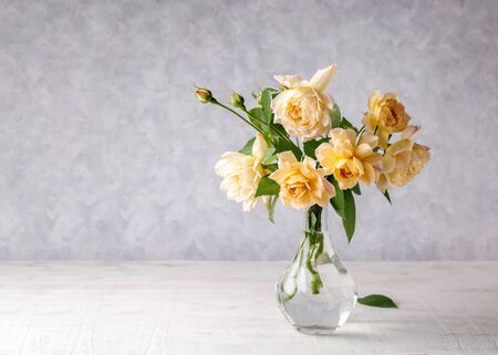 Bouquet of delicate roses on a gray background. Copy space.の写真素材