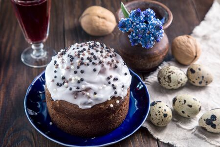 Easter breakfast with a cupcake, boiled eggs and wine.