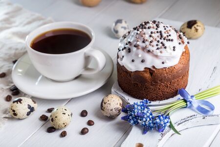 Easter breakfast with coffee, cupcake and boiled eggs.