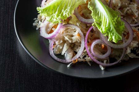 Homemade sauerkraut with carrots and red onions.の写真素材
