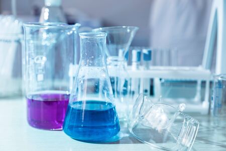 Chemical liquid in glass flasks and test tubes in a medical laboratory.