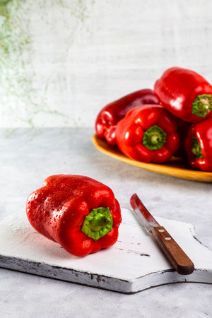 Fresh sweet peppers on a light table.の写真素材