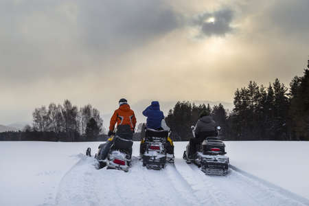 Snowmobiling in the Urals mountains on a frosty day.の写真素材